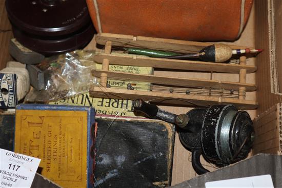 A box of vintage fishing tackle